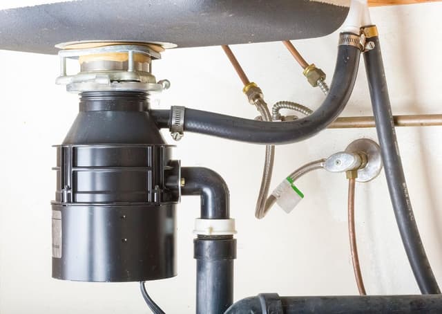 Garbage disposal under kitchen sink
