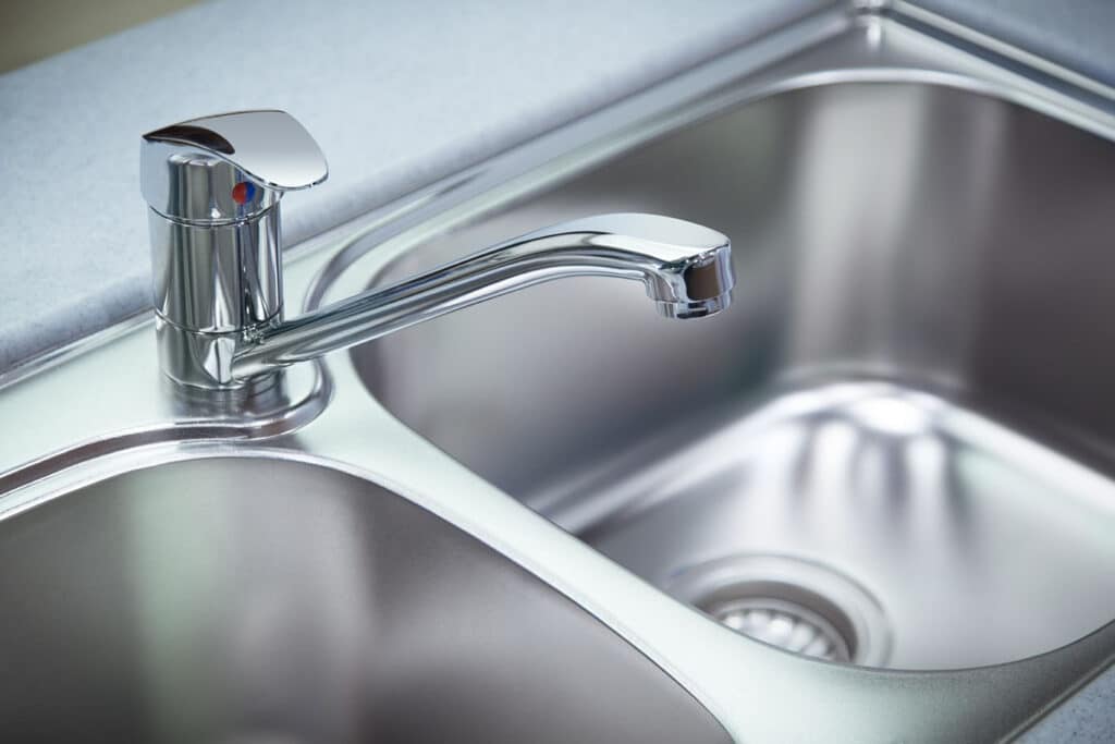 A kitchen sink that has recently had garbage disposal cleaning in Summerville, SC