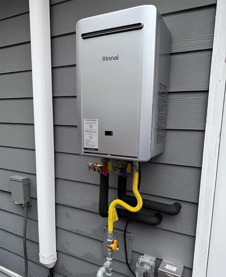Rinnai tankless water heater installed on exterior wall by Kinsmen Service Pros in Summerville, SC