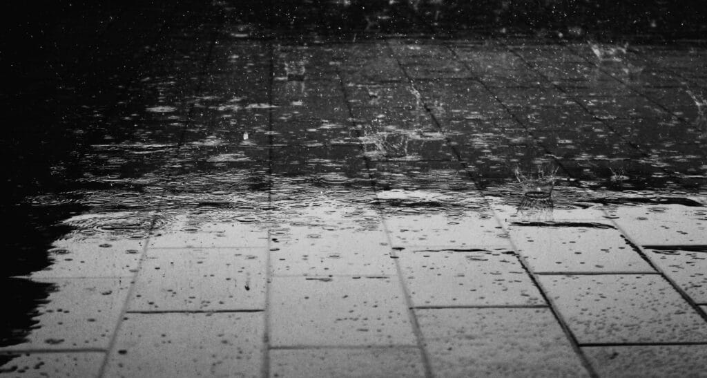 Rain outside of a Summerville, SC home, a sump pump can help prevent flooding during storms.